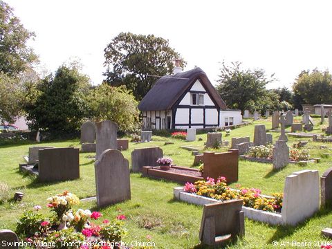Recent Photograph of Thatched Cottage by Church (Swindon)